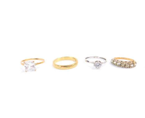 Three 9ct gold and gem set rings, together with a 9ct gold wedding band, sizes L-P, 5.7g.