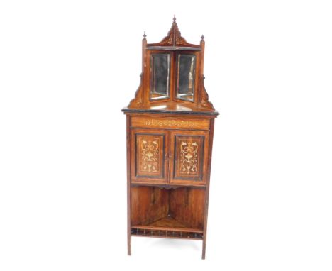 A Victorian rosewood and inlaid corner cabinet, with shelf and double mirror back, over a pair of cupboard doors, the whole i