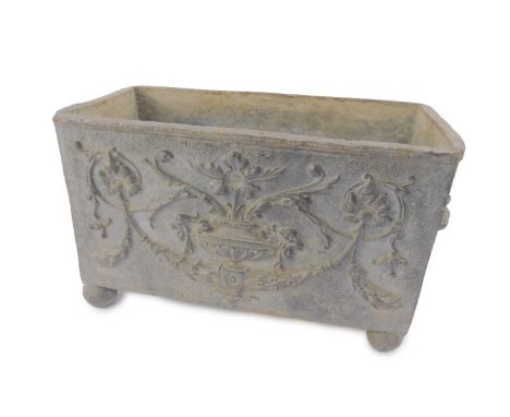 A Georgian lead planter, of rectangular form with twin lion's head and ring handles, cast with classical urns, flowers and wr