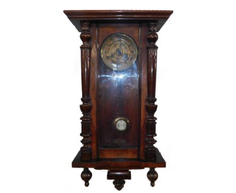 An American walnut late 19thC wall clock, circular brass dial with chapter ring bearing Roman numerals, eight day movement wi
