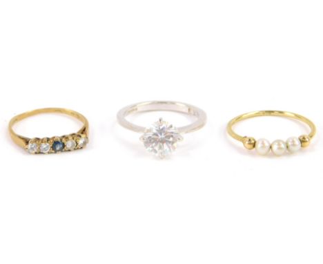 Three 9ct gold rings, comprising a cubic zirconia solitaire ring, set in white gold, size R , 9ct gold and three pearl ring, 