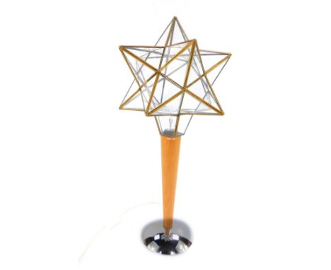 A 1970's starburst table lamp, raised on a wooden shaft and metal base, 48cm H.