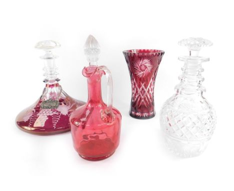 A ruby flashed glass ship's decanter decorated with vines,  ruby glass vase of waisted form, 20cm H, cranberry glass jug with