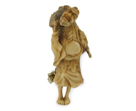 A Japanese bone netsuke, early 20thC carved as a deity with a frog upon his back, 8cm H.