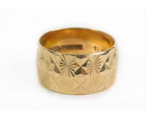A 9ct gold thick wedding band, with engraved decoration, size P, 5.4g.