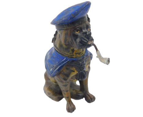 An early 20thC cold painted lead figure of a novelty bulldog, HMS Terrible, seated wearing a naval cap and collar, and smokin
