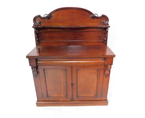 A Victorian mahogany chiffonier, the scrolling shaped back with serpentine shelf raised on double C scroll suppotst, above on