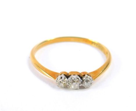 An 18ct gold and diamond three stone ring, approx 1/8th ct, size O, 1.6g.