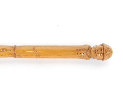 A Miner's Deputy stick, of carved figural form, 92cm L.