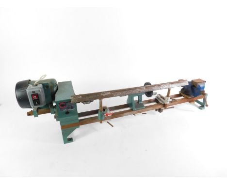 A Tyme Cub wood turning lathe, serial no 8871012, together with a box of wood turning tools.