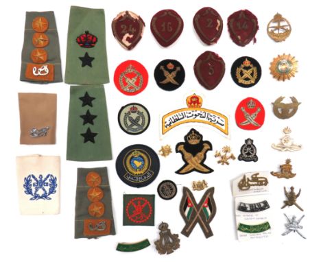 38 x Far East Badgesvaried selection of loose badges including brass, Saudi Arabia Armoured Forces ... Gilt and enamel Saudi 