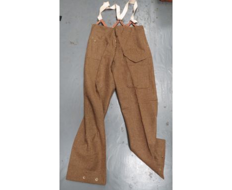 Pair Of 1940 Dated Battledress Trouserskhaki woollen, wide leg trousers. Â Side slash pockets . Â Right hip first aid pocket.