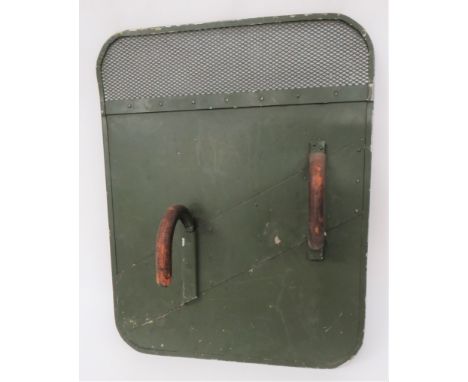 Early Post War British Army Riot Shieldgreen painted, rectangular alloy shield. Â The top with mesh visor. Â Rear fitted with