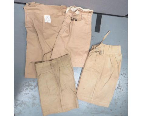 Four Pairs Of WW2 Pattern Military Shortsconsisting light khaki drill shorts. Â Side slash pockets. Â Front first aid pocket.