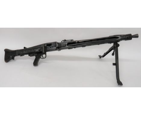 Deactivated M53 Yugoslavian Light Machine Gun7.92 mm, 26 inch hidden barrel. Â Front flash hider. Â Pierced, square form barr