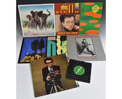 12 Vinyl L.P.'s - Elvis Costello and The Attractions; My Aim is True (green back cover); Armed Forces (with free single and 4