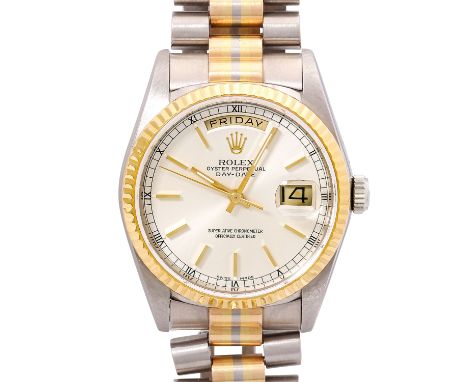 ROLEX Day-Date Tridor. Ref. 18239. Herren Armbanduhr. 18K Gold. Automatik-Werk Kal. 3155. Silbernes  Zifferblatt. Guter Zusta