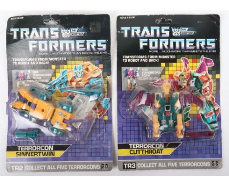 Vintage Hasbro Transformers G1 Terrorcon Sinnertwin and Cutthroat carded figures, 1987 “Sinnertwin” figure is on a unpunched 