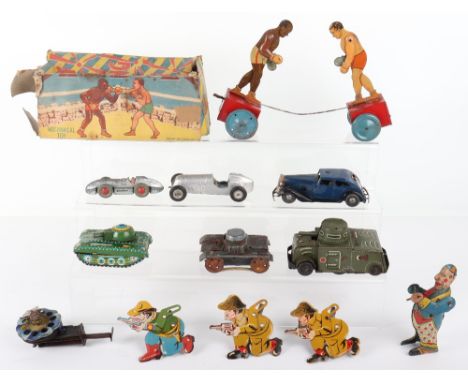 British tinplate boxing toy and other novelty toys, flat tinplate boxers with hinged arms on wheels bases with working c/w me