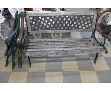 A cast iron ended garden bench and two pairs of bench ends 