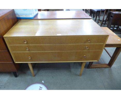 A light oak three drawer chest 