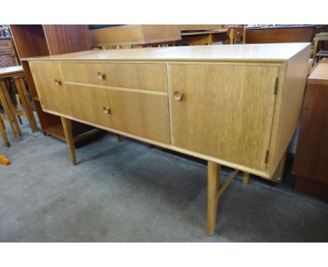 A small 1970's light oak sideboard 