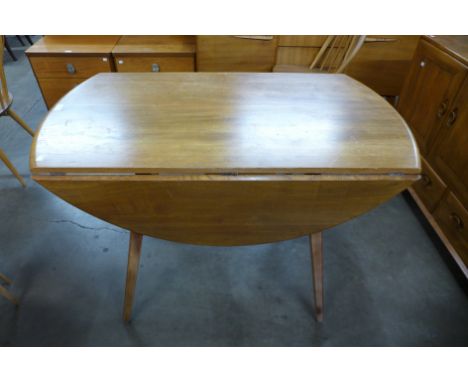 An Ercol drop-leaf dining table 