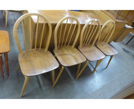 A set of four Ercol blonde chairs 