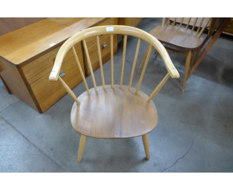 An Ercol blonde cow horn armchair 