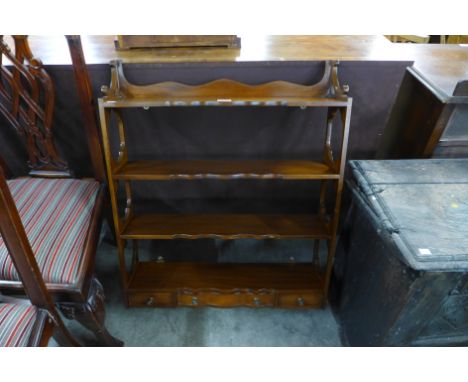 A mahogany open wall shelf 