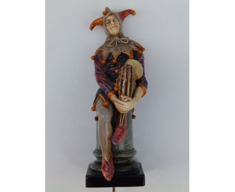 A Royal Doulton Jester HN1702, 10" - currently used as a lamp, minor losses to costume, hairline crack to base.