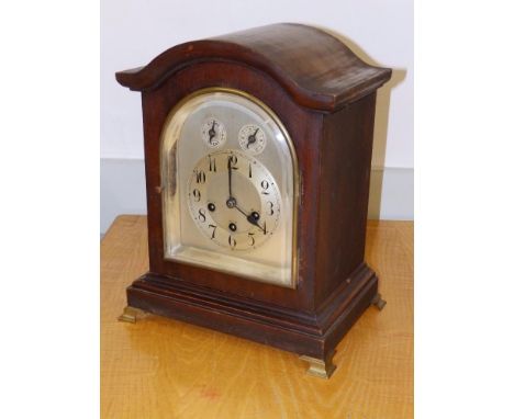 A German chining mahogany bracket clock with silvered dial by Junghans, Wurtenburg, 15" high.