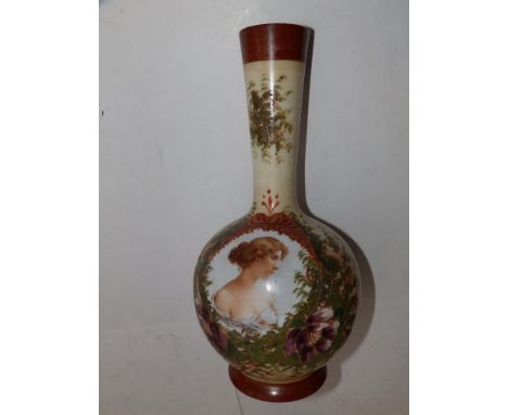 A late Victorian opaque glass bottle vase with colour printed female portrait, 15" high.