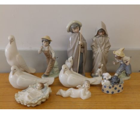 Three Nao porcelain doves and six other Nao figures/groups. (9)