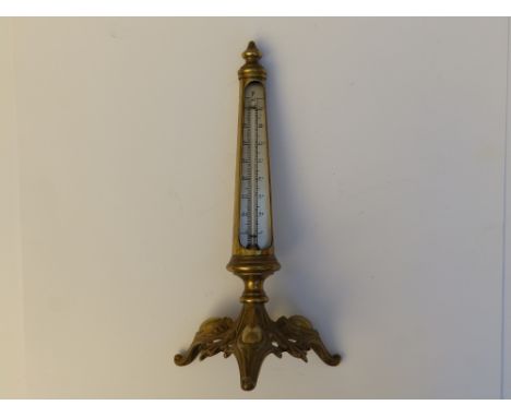 A Victorian brass tripod thermometer, 9.5" high.