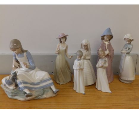 A large Nao porcelain group - Girl with goat, 11" across - one horn incomplete together with six other Nao female figures. (7