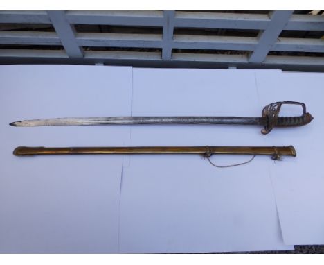 A Victorian Infantry sword with 32" Wilkinsons blade in brass scabbard, 39" overall.