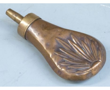 Copper and brass pistol or revolver powder flask with embossed decoration to both sides, 11cm long. 