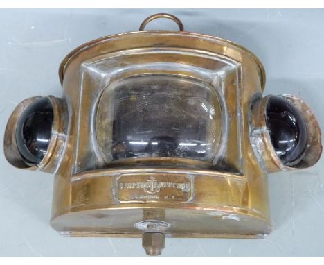 Simpson Lawrence ship's lamp with central clear lens flanked by coloured bullseye lenses, width 27cm