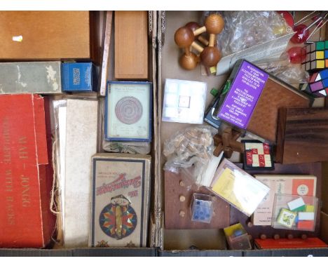 A collection of vintage games including a wooden chess set, Mah Jong, solitaire, Scandinavian wooden puzzle toys, Designoscop