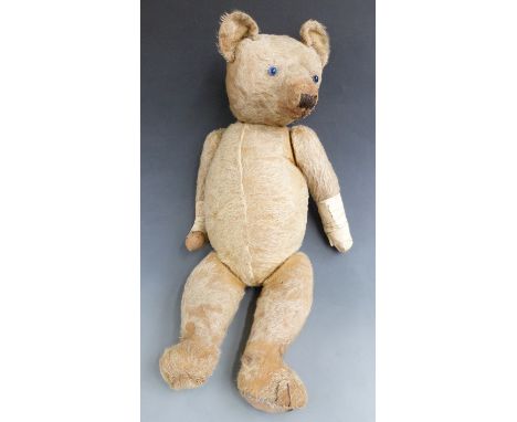 COLLECTING Vintage Teddy bear with blonde mohair, cocked feet and wrists, shaved snout, growler and glass eyes, possibly Stei