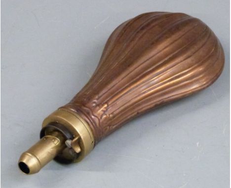 Copper and brass powder flask with reeded decoration to both sides, 20.5cm long. 