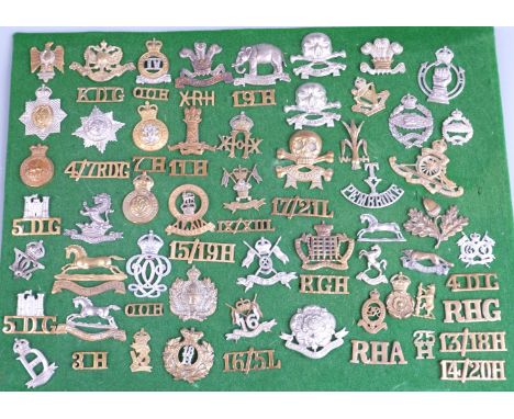 Over 60 British Army cap badges and shoulder titles for cavalry regiments including Royal Gloucestershire Hussars, 10th Hussa