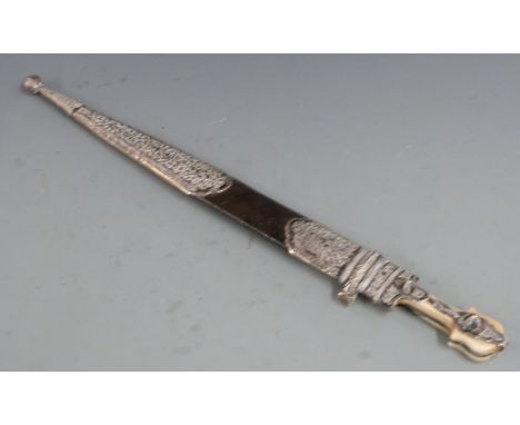 A 19th/20thC Eastern short sword in scabbard with bone and niello white metal hilt, double fullered blade and ornate leather 