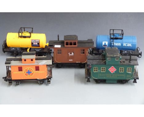 Five Bachmann and similar G gauge vans and tankers including Chemical, Railway Express Agency, East Coast Railway, Rio Grande