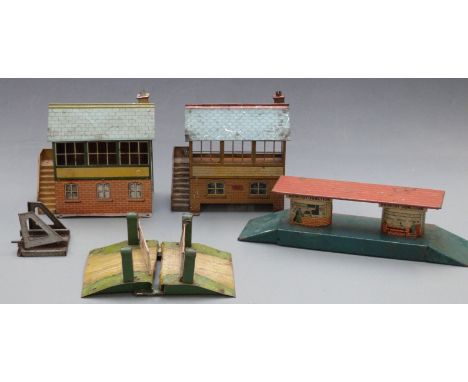 Five Hornby and similar 0 gauge model railway buildings and accessories comprising two signal boxes, Brimtoy Junction station