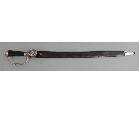 German hunting sword circa 1770 with clam shell guard and 52cm single edged fulllered blade, with silver mounted leather scab