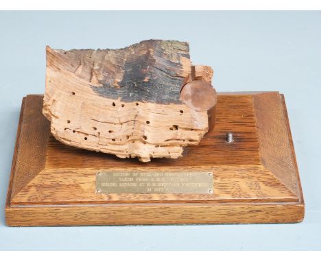 HMS Victory mounted section of keel and rivet, the rivet having broad arrow stamps, length of oak base 29cm