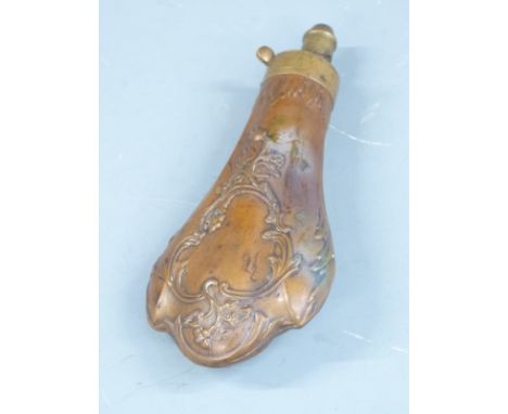 Copper and brass powder flask with embossed decoration to both sides, 20.5cm long.&nbsp;