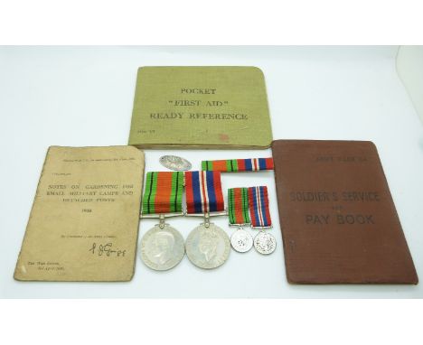 British Army WWII medals comprising War Medal and&nbsp;Defence Medal with miniatures and silver identity disc named G H McLeo